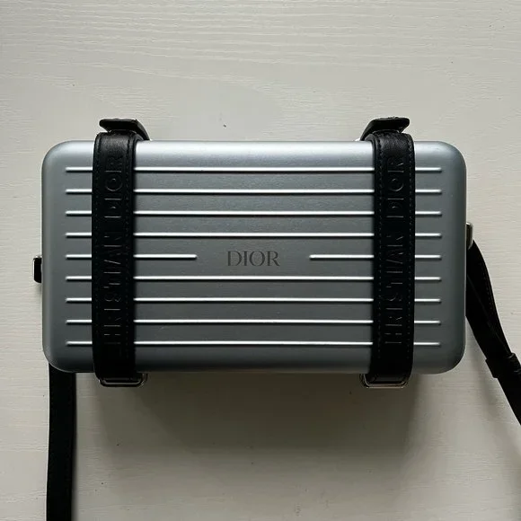 Dior and rimowa personal clutch hotsell